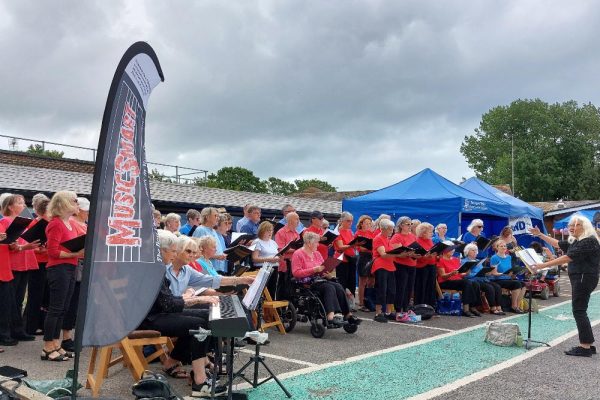 Bognor Regis Friends of the Hospital fete whole choir singing with keyboards